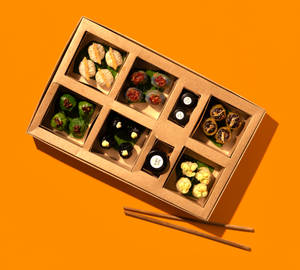 Craft-casual pan-Asian delivery aesthetic, supporting dish in this style